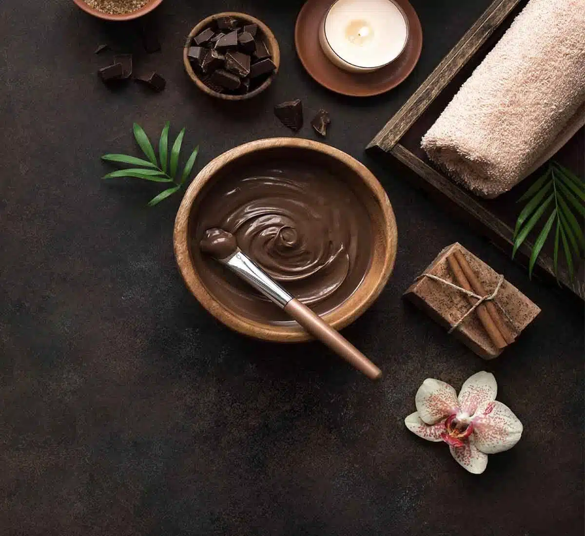 spa in laguna phuket: Chocolate spa mask with candle and towels at Apsara Spa, Phuket
