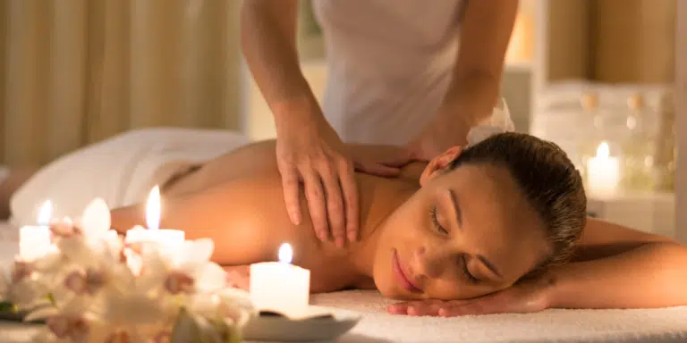 best massage in laguna phuket: Relaxing back massage with soft candlelight ambiance at Apsara Spa