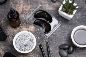 Gua Sha facial massage: Luxury spa accessories including salt, massage stones, and eye patches