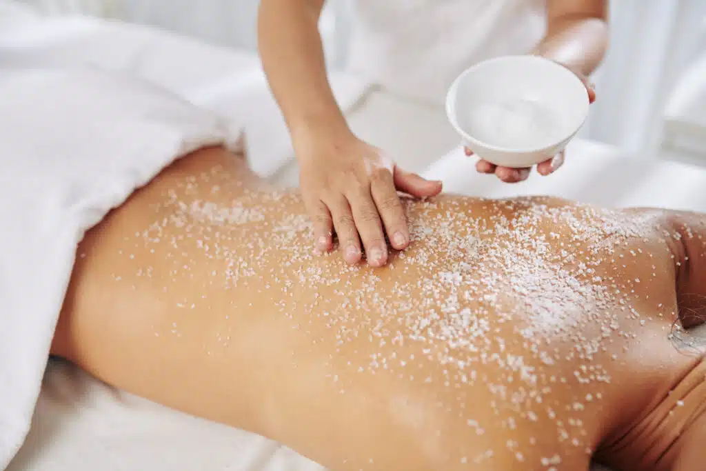 Body scrubs in Phuket: Exfoliating body scrub treatment at a spa.