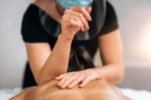 deep tissue massage in Phuket: Therapist performing deep tissue massage.