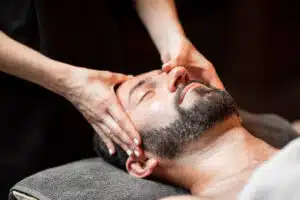 Indian head massage in Phuket: Man receiving calming Indian head massage therapy