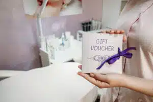 spa gift voucher in Phuket: Spa gift voucher presented with ribbon in beauty clinic